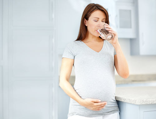 pregnant woman drinking contaminated water